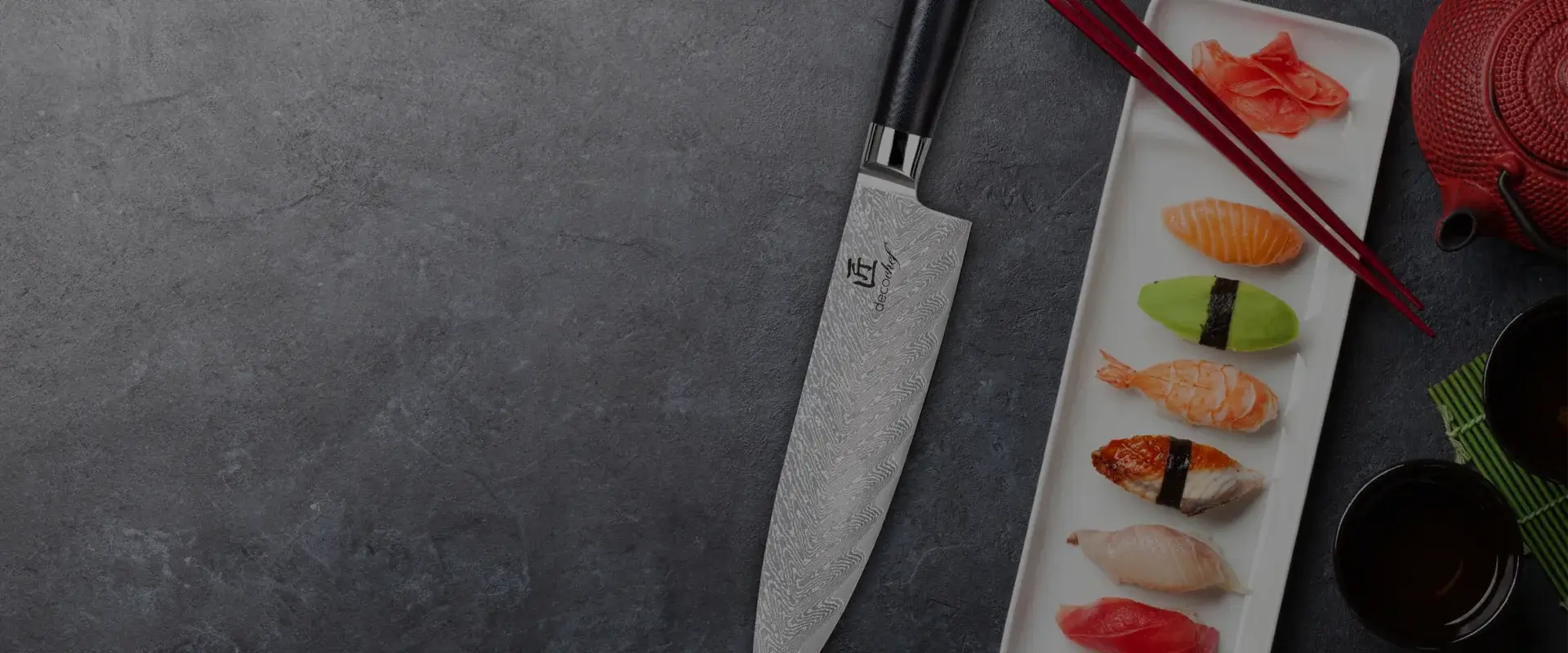 Deco Chef Chef Knife on a dark background with a sushi platter