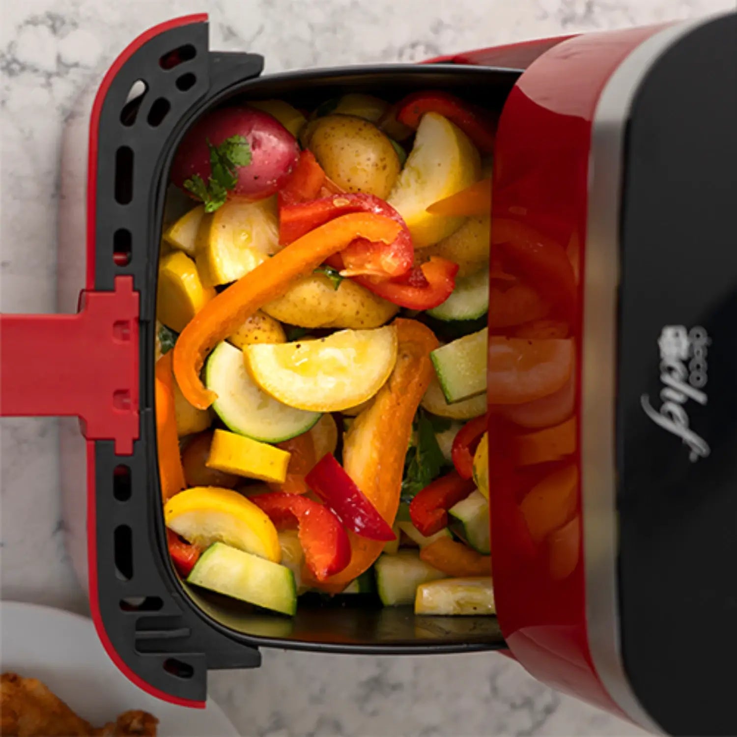 Vegetables in air fryer pot