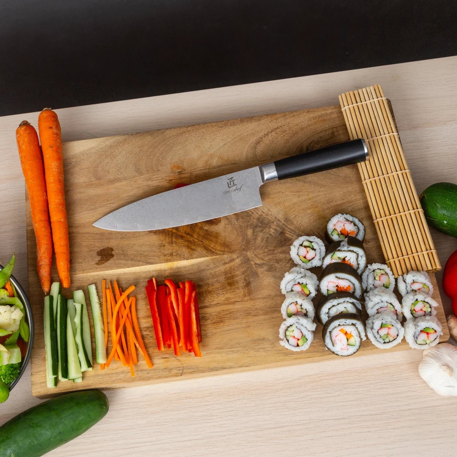 Deco Chef Chef Knife on a cutting board with a sushi platter
