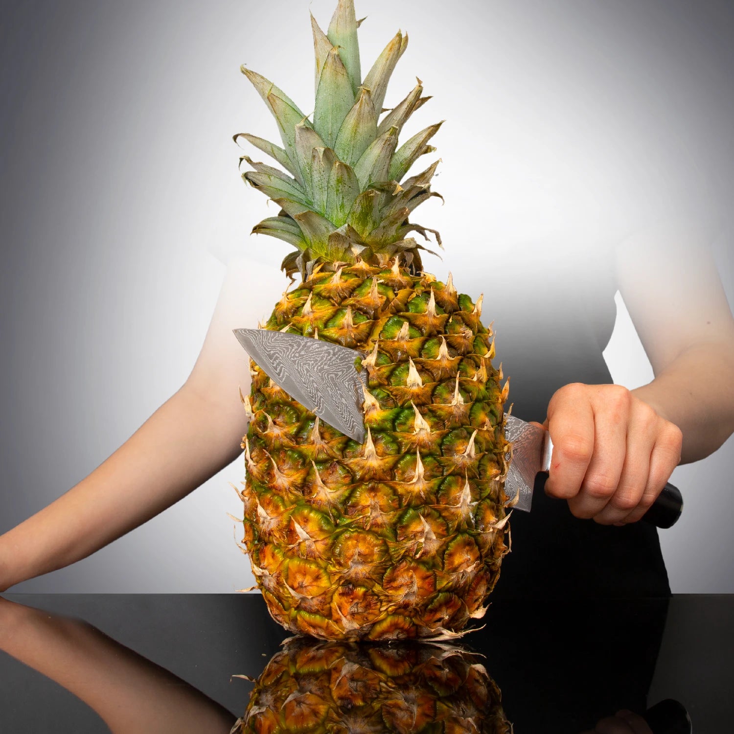 Deco Chef Chef Knife cutting a pineapple