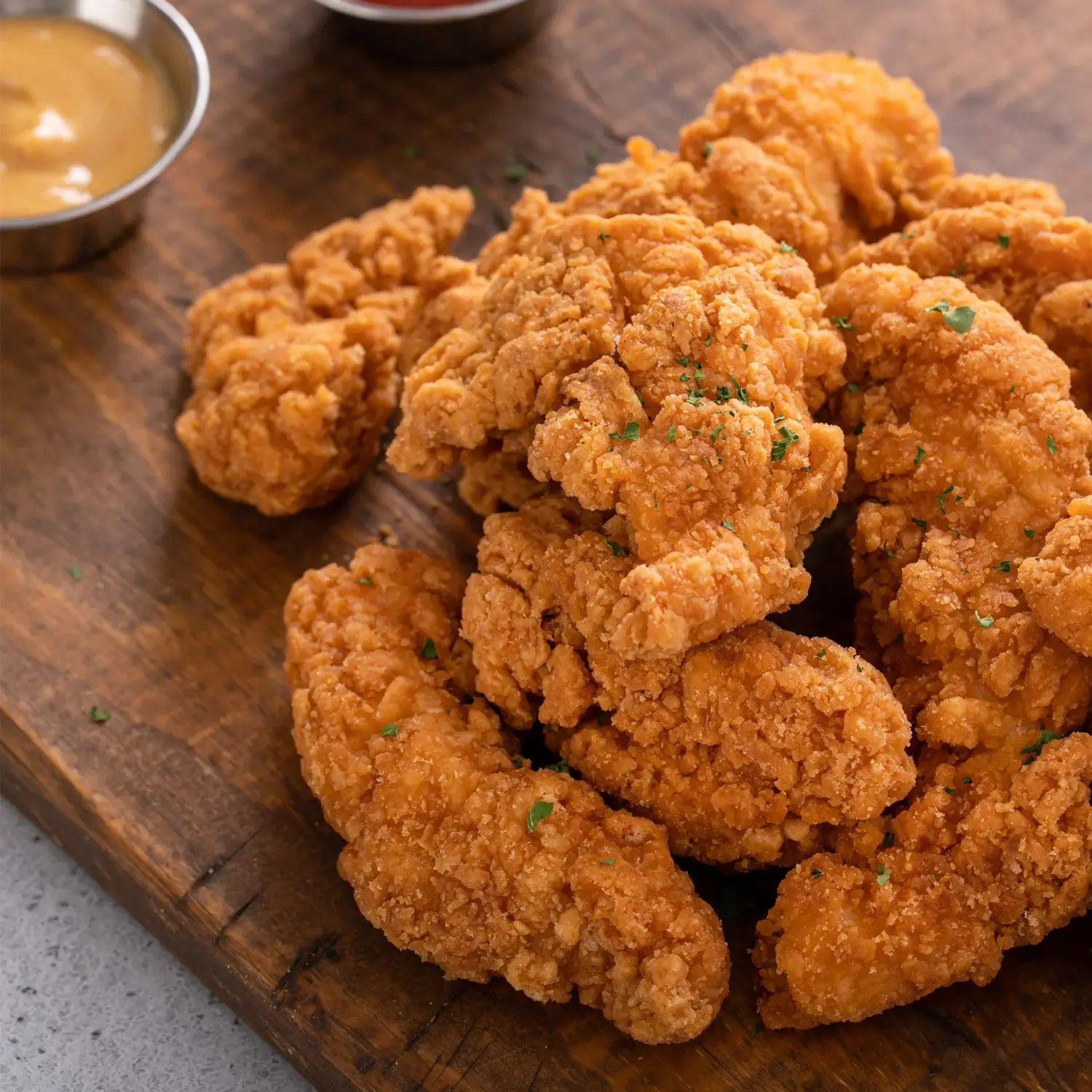 Chicken tenders on cutting board