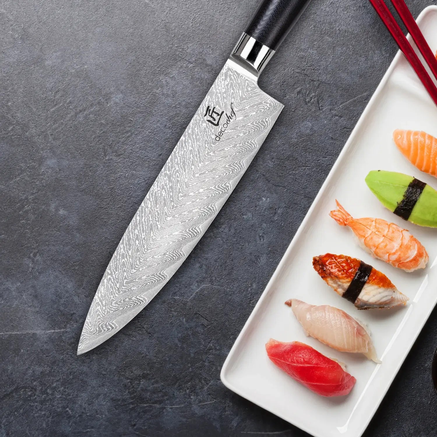 Chef knife on dark table with sushi platter