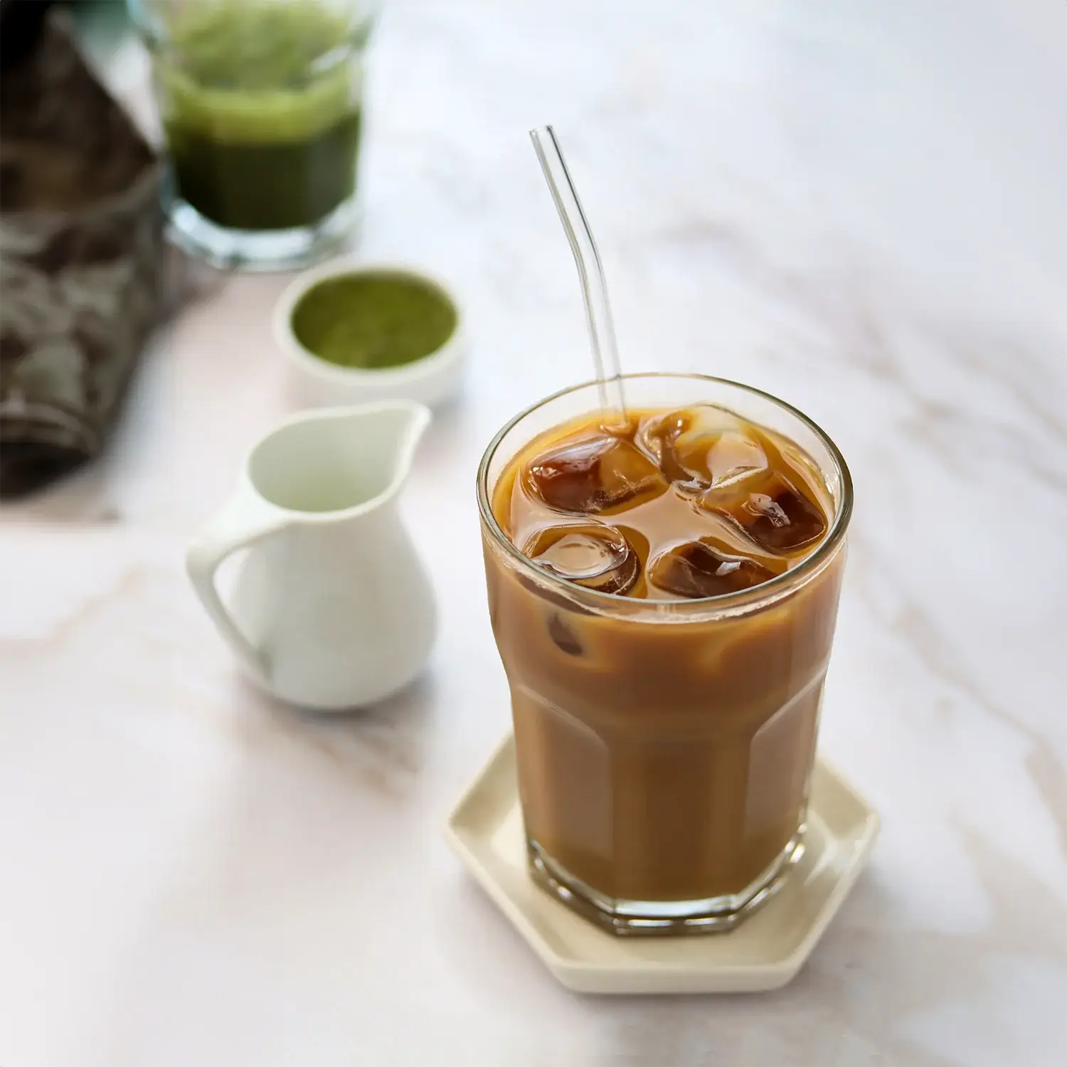 Iced coffee on white table